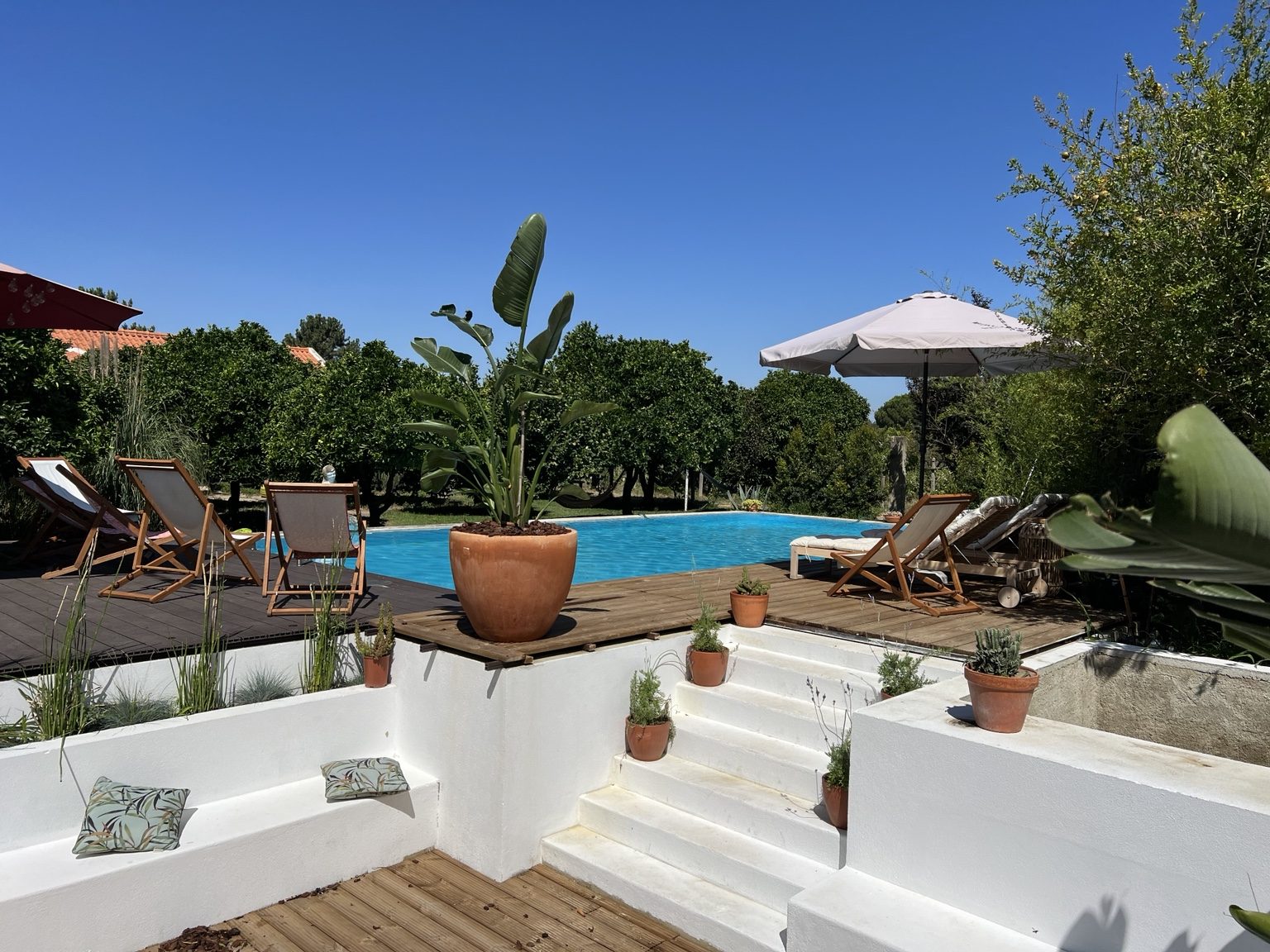 Private rural pool area with deck and garden